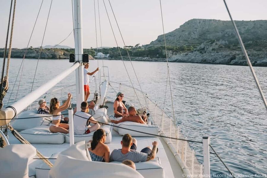 Rhodes: Sunset Cruise w/ Gourmet Buffet, Drinks & Live Music - Sunset at sea, with a band instead of background music