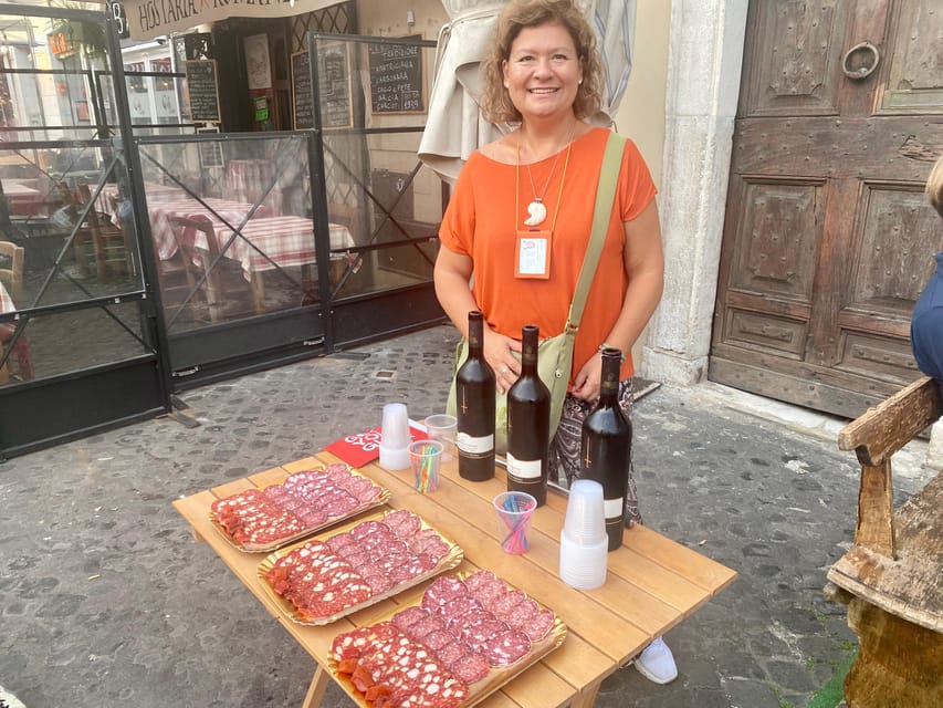 Rome: Jewish Quarter and Campo de' Fiori Street Food Tour - Entering the Jewish Quarter through Portico dOttavia