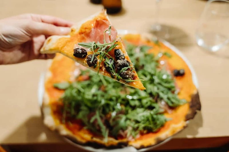 Rome: Pizza Making Class with Gelato & Drinks Included - Stretching and topping your own pizza