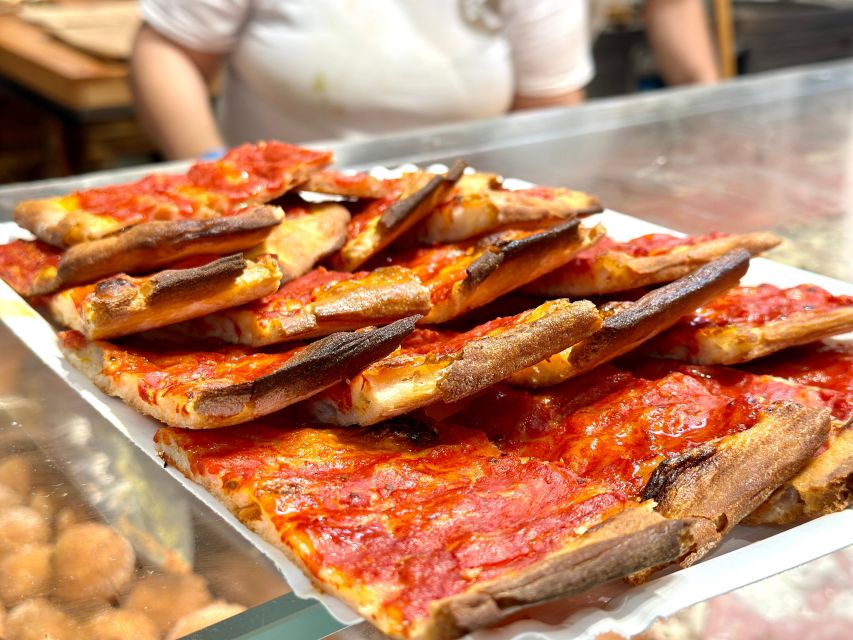 Rome Street Food: Delights at Campo dei Fiori & Ghetto Area - Via del Biscione reveals a quieter side of central Rome