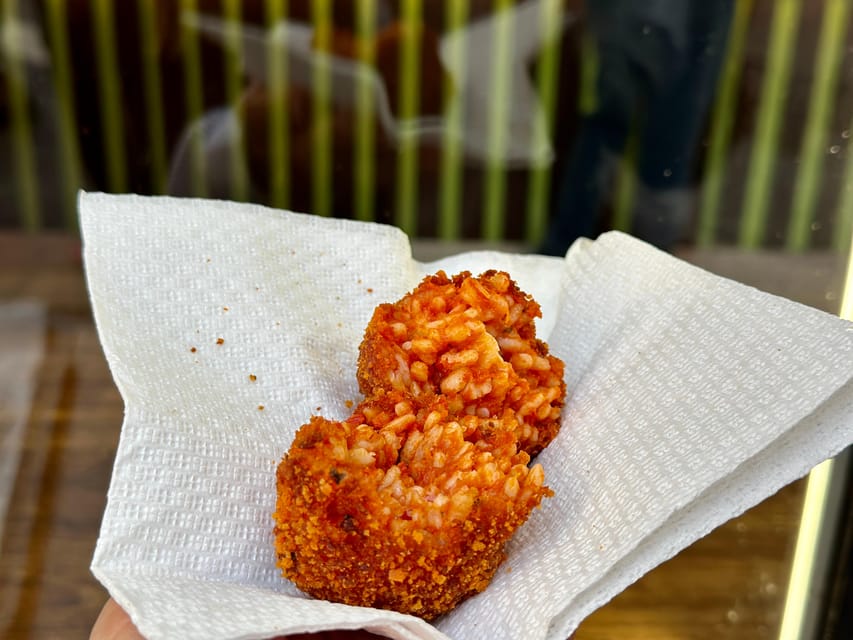 Rome Street Food: Delights at Campo dei Fiori & Ghetto Area - Largo di Torre Argentina ends the walk with ancient Rome
