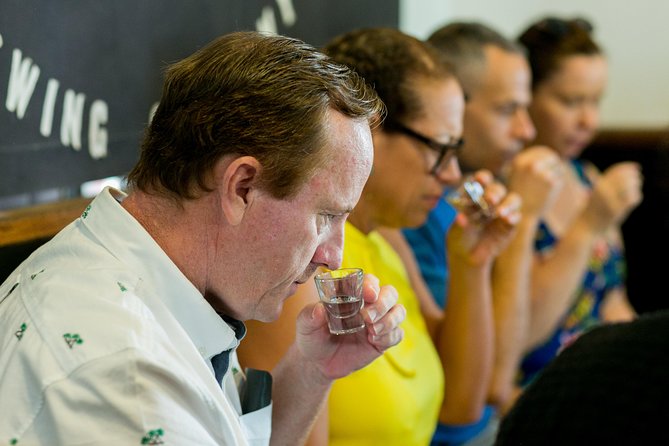 Rum Tasting and Food Walking Tour in Nassau Bahamas - Nassau by rum glass and walking shoe