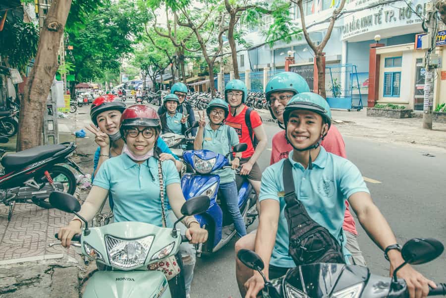 Saigon: Best Price Authentic Food Tour with Female Rider - District 10 brings grilled banana with coconut