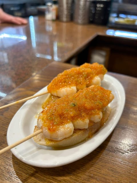 San Sebastian Food Tour with Pintxos & Drinks with a Local - Plaza de la Constitución and the city between bites