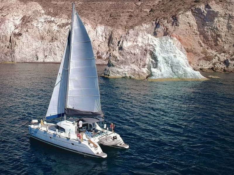 Santorini: Catamaran Cruise with Food and Drinks - Red Beach and the first swim