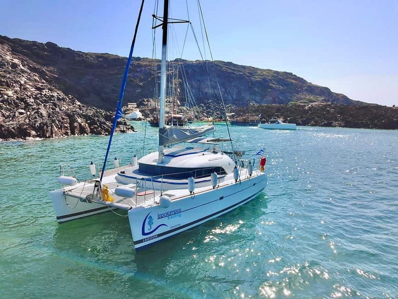 Santorini: Catamaran Cruise with Food and Drinks - White Beach, Indian Rocks, and the lighthouse