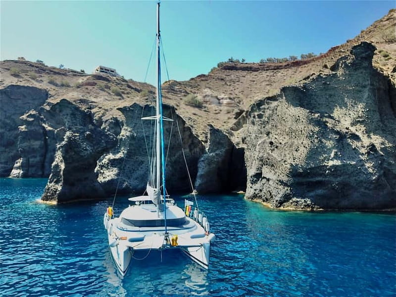 Santorini: Catamaran Cruise with Food and Drinks - Sailing back with music and caldera views