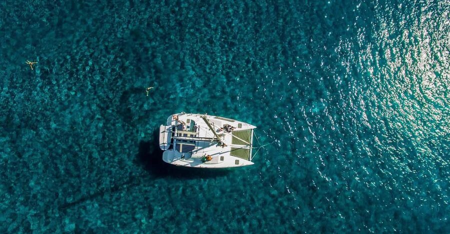 Santorini: Private Catamaran Cruise with Food & Drinks - Lighthouse, Indian Rock, and the outer Caldera