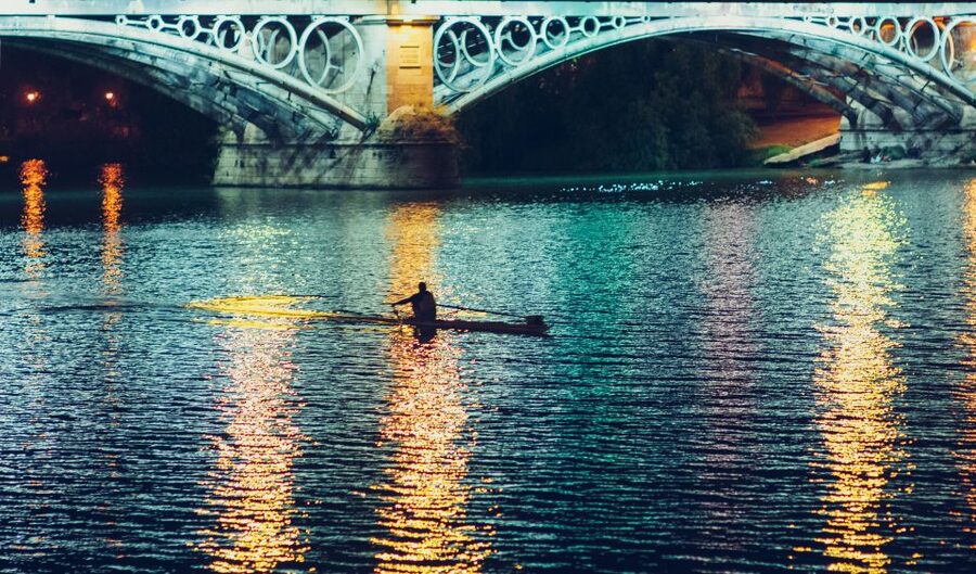 Seville: Tapas Tour Across the River in Triana - Crossing the Isabel II Bridge into local Seville