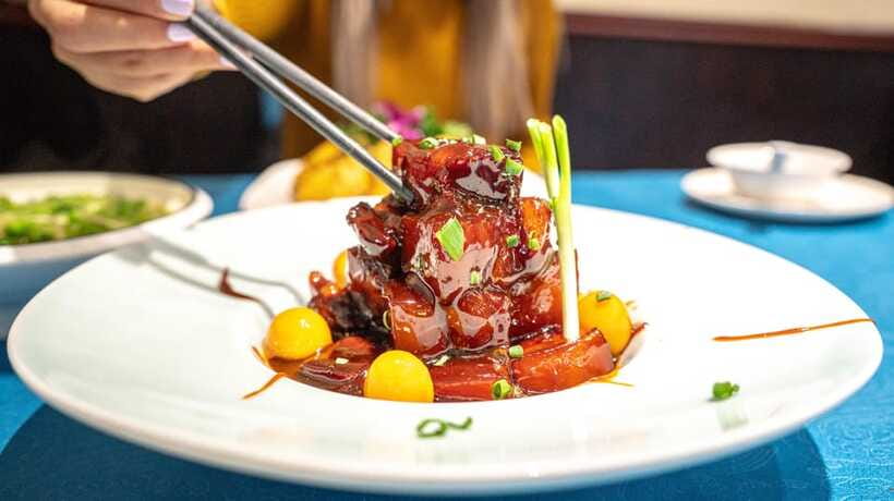 Shanghai: Evening Walking Food Tour - Walking through the French Concession between meals