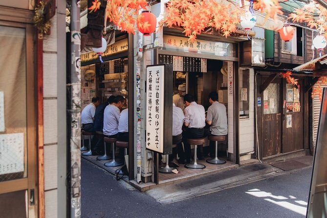 Tokyo After 5: Authentic Japanese Food & Drink Night Tour - Tsukishima Monja Street and the sizzle of monjayaki