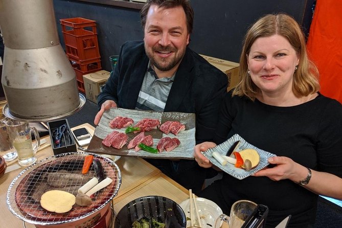 Tokyo Night Foodie Tour in Shinjuku - Seasonal Sushi, Wagyu Beef - Walking through Kabukicho’s neon core