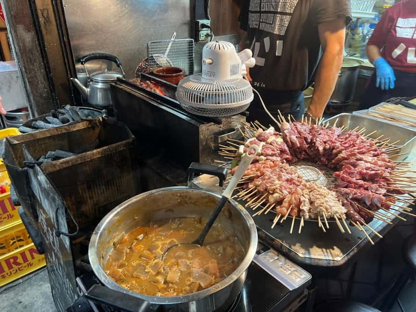 Tokyo: Shinjuku Food Tour (15 Dishes and 4 Eateries) - Kabukicho after dark: food, signs, and local orientation