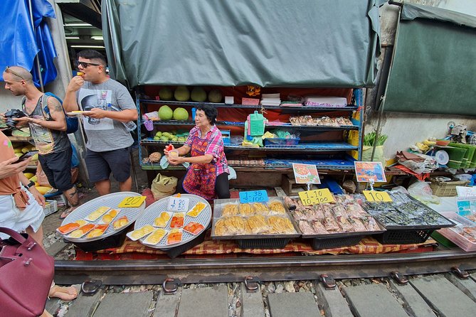 Train & Floating Market Food Adventure + Scenic train ride - Thai snacks, fruit, and the food connection