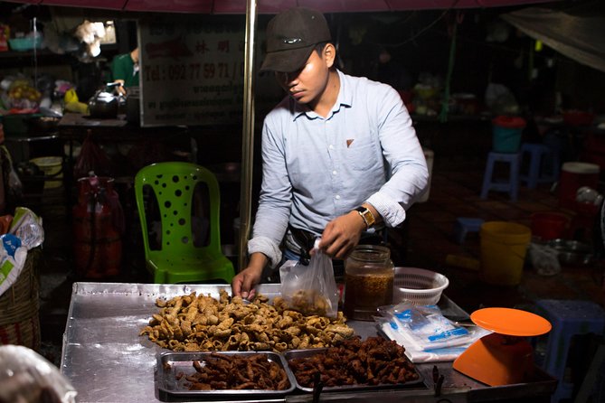 Ultimate Phnom Penh Food Tour by Tuk Tuk: 20 Tastings and Drinks - Russian Market after dark, with ribs and local ingredients