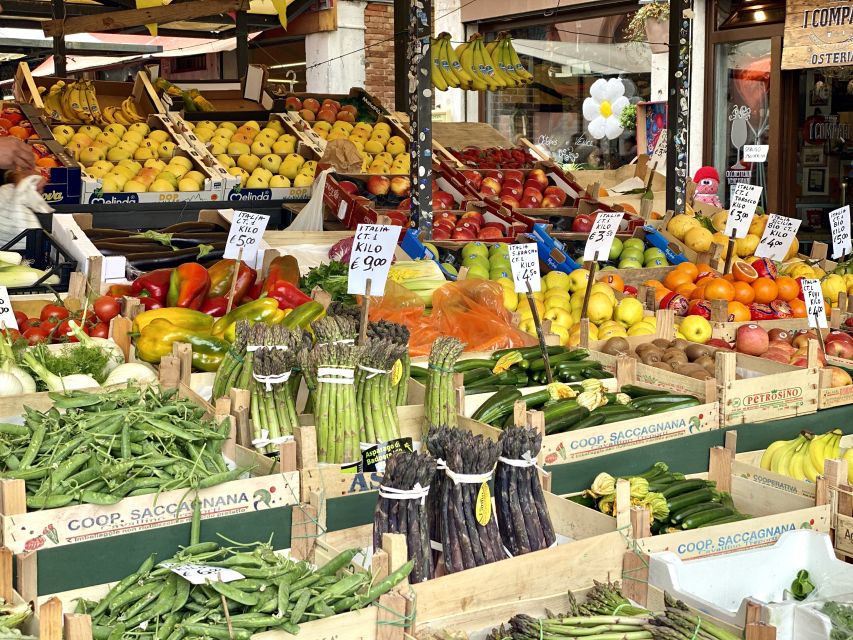 Venice: Street Food Tour with a Local Guide and Tastings - Crossing Rialto Bridge to the market