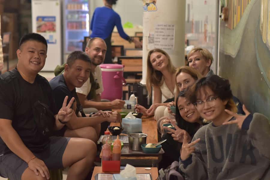 Weekend Hanoi Night Market & Street Food Tour - Walking through Hang Dao Street Night Market